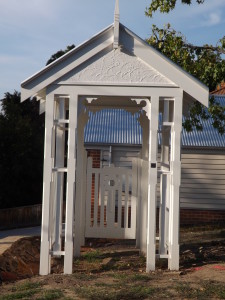 wooden_gate_house_corrugated_roof